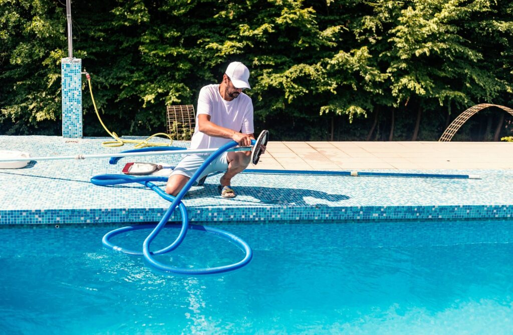 friendly pool maintenance team blue uniforms outdoor pool